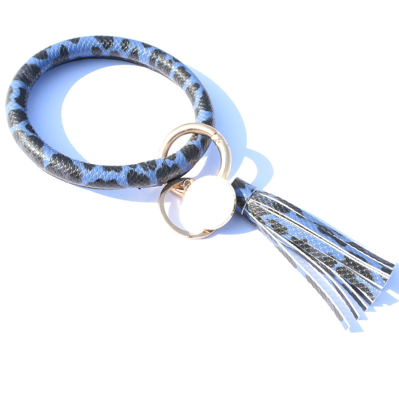 Llavero de muñeca de borla de estampado de leopardo PU al por mayor